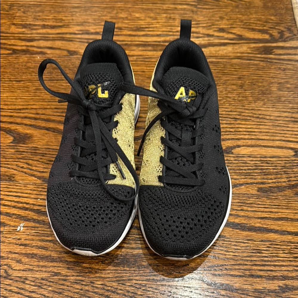 APL Black and Gold Sneakers with Sleek Design